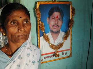 Babytai Bais with a portrait of her husband